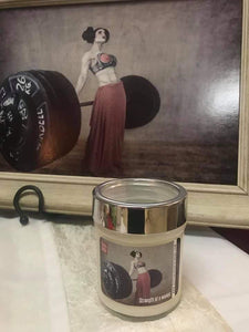 "Strength of a Woman," art by Shanna Koltz on a Soy candle with crackling wooden wick in a 10oz Glass Jar with a shiny lid