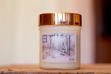 Load image into Gallery viewer, &quot;Winter Wonderland&quot; label on a 10oz Soy Candle with a wooden wick and a metallic lid. Choose your scent