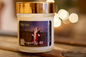 "Starry Christmas Eve" Label on a 10oz soy candle with wooden wick and a metallic lid