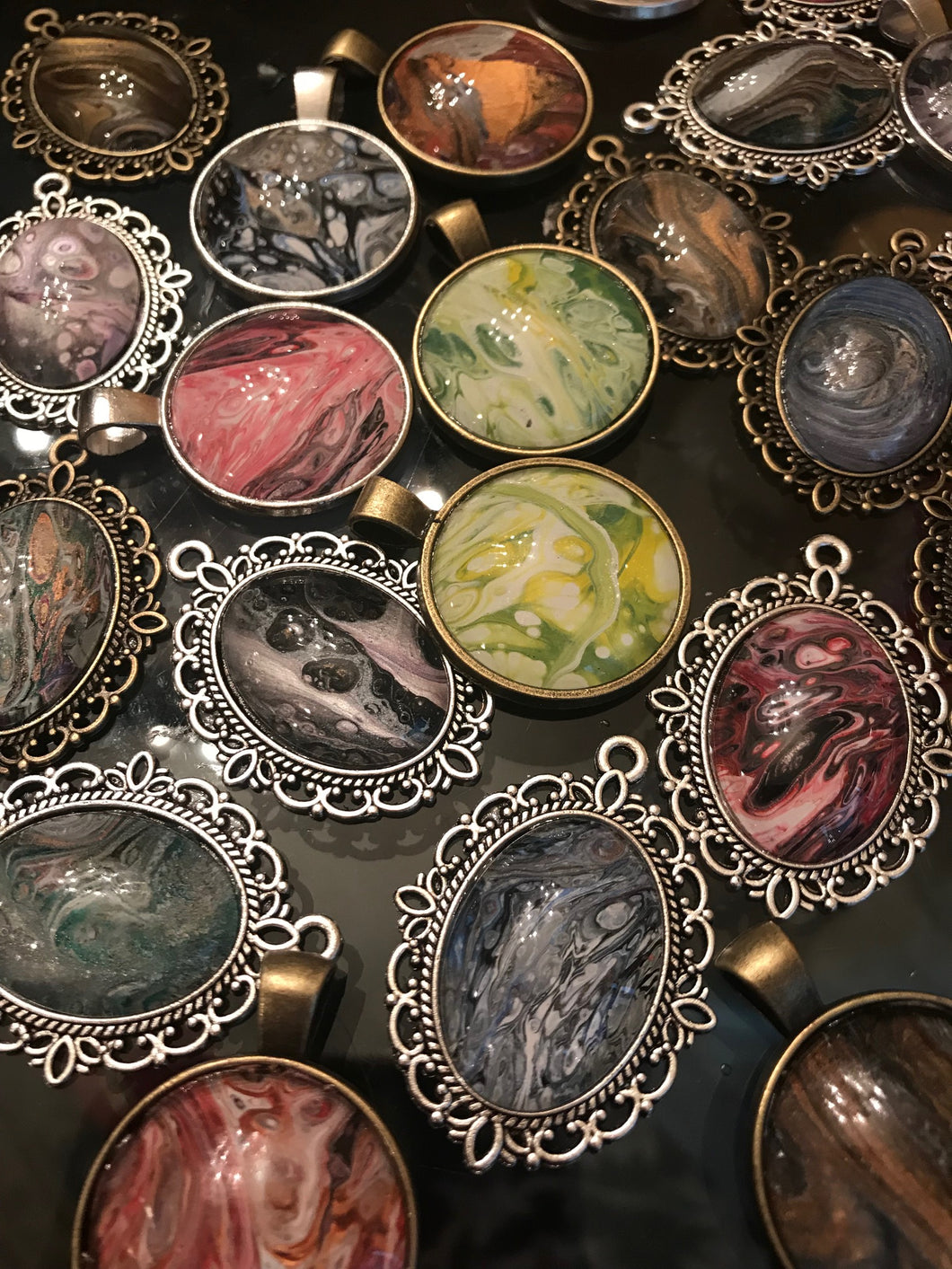 One of a Kind Necklace pendants made from the drippings of an original painting by Shanna Koltz.