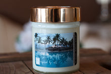 Load image into Gallery viewer, &quot;Tropical Vacation,&quot; art by Shanna Koltz on a Soy candle with crackling wooden wick in a 10oz Glass Jar with a shiny lid