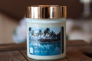 "Tropical Vacation," art by Shanna Koltz on a Soy candle with crackling wooden wick in a 10oz Glass Jar with a shiny lid