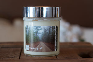"The road ahead," art by Shanna Koltz on a Soy candle with crackling wooden wick in a 10oz Glass Jar with a shiny lid